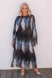 Model Sandy wearing the Silk Blend Cape Dress in colour Nero (Blue), from the front, showing the whole outfit