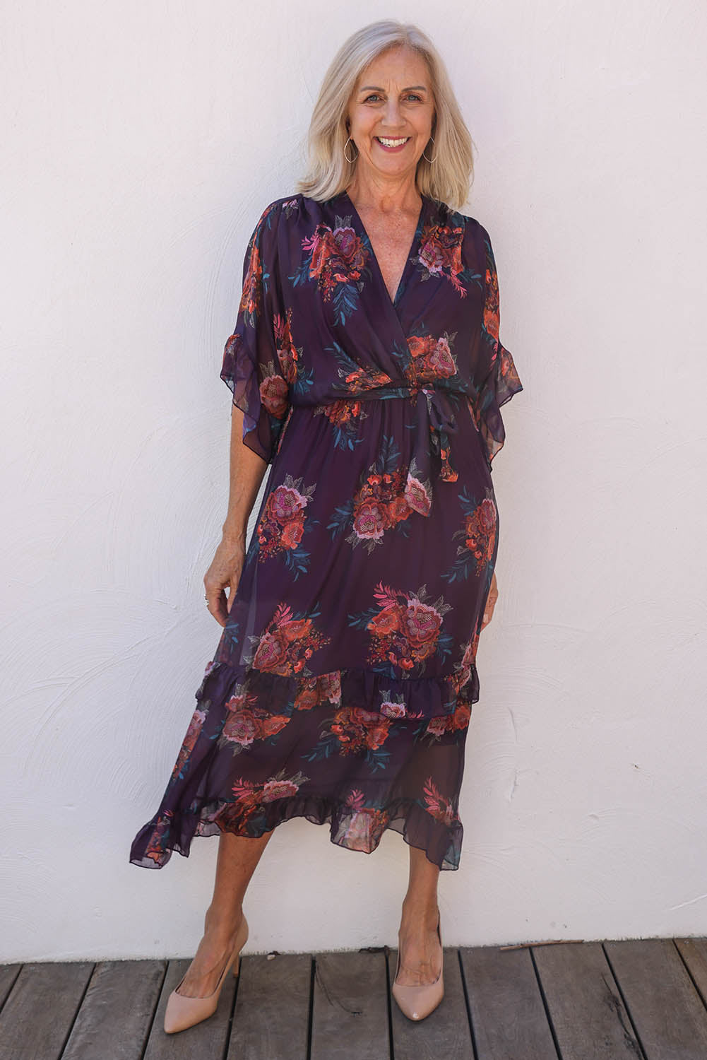 Model Sandy wearing the Frill Sleeve Silk Blend Print Dress in colour Orchidea (Purple), from the front, showing the whole outfit