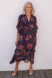 Model Sandy wearing the Frill Sleeve Silk Blend Print Dress in colour Orchidea (Purple), from the front, showing the whole outfit