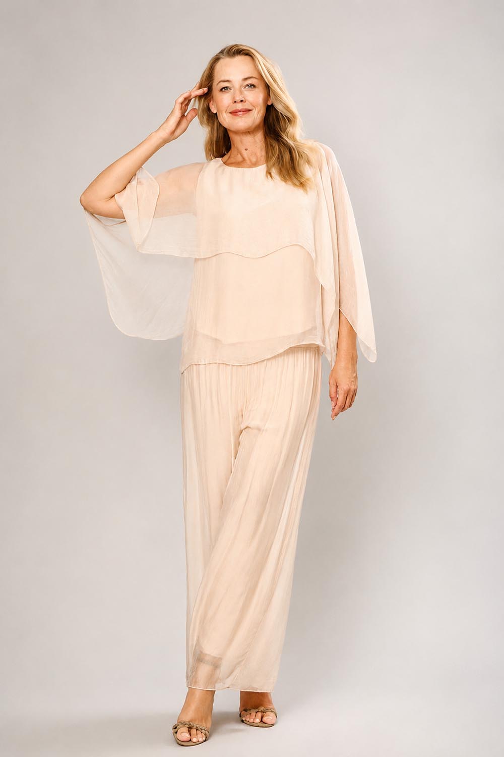 Model Genericm wearing size sample of the Silk Blend Cape Top - Beige in colour Beige, from the front