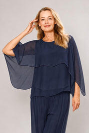 Model Genericm wearing size sample of the Silk Blend Cape Top - Navy in colour Navy, in a cropped view