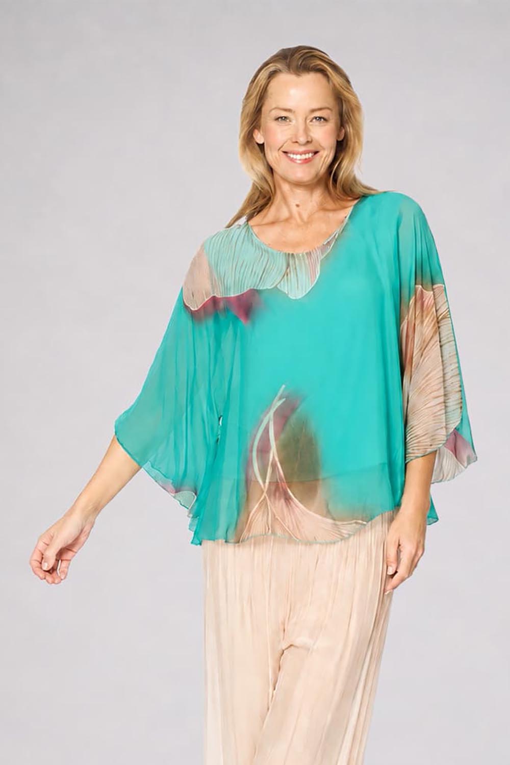 Model Genericm wearing size sample of the Silk Blend Flounce Sleeve Top - Blueturqprint in colour Blueturqprint, in a cropped view