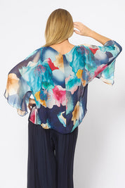 Model Genericm wearing size sample of the Silk Blend Flounce Sleeve Top - Navyfloral in colour Navyfloral, from the back