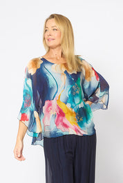 Model Genericm wearing size sample of the Silk Blend Flounce Sleeve Top - Navyfloral in colour Navyfloral, in a cropped view
