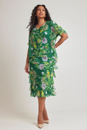 Model Terri-Leigh wearing size L of the Overlay Silk Print Dress in colour Greenflora (Green), from the front, showing the whole outfit