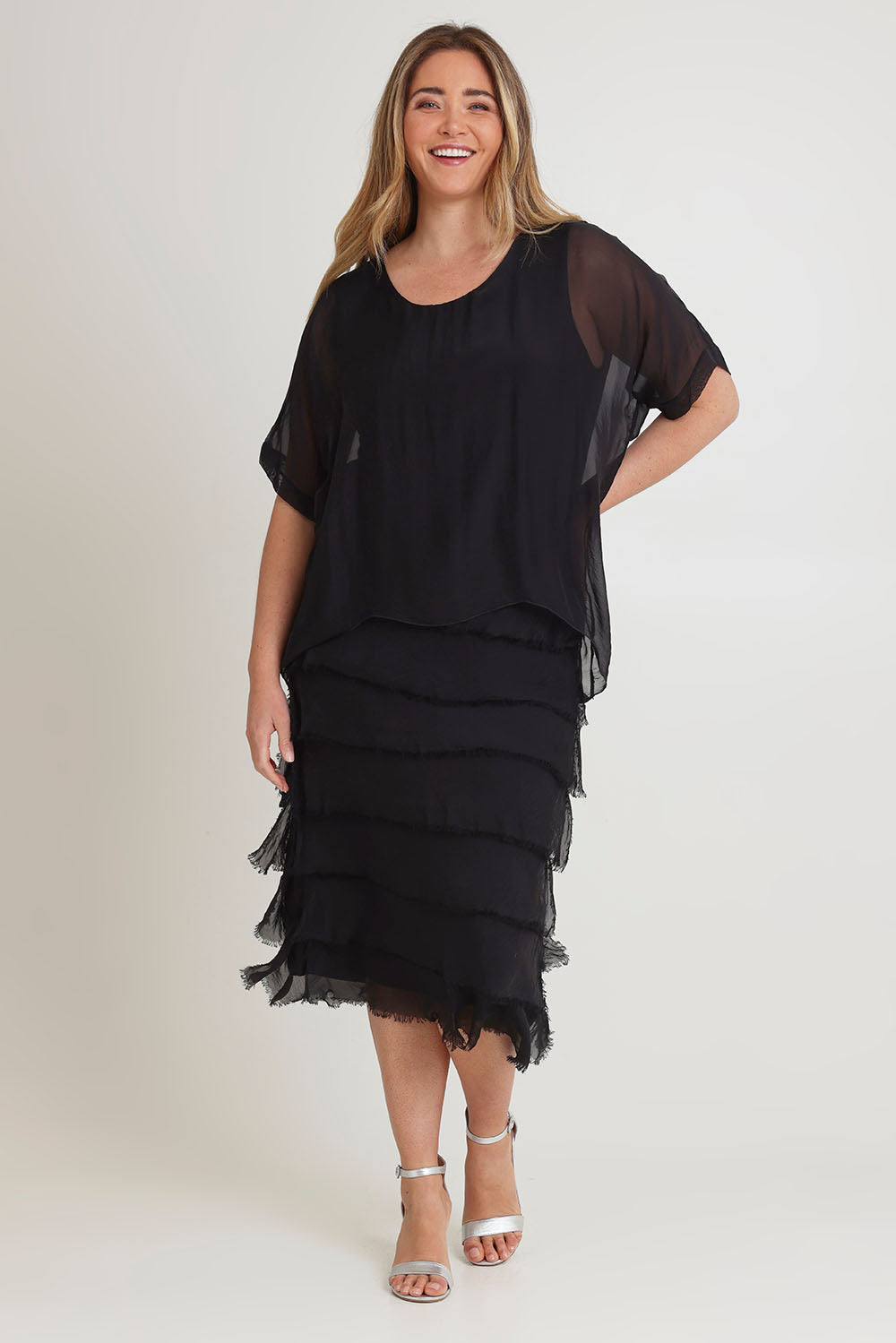 Model Chanel wearing the Silk Blend Multi Layers Dress in colour Black (Black), from the front, showing the whole outfit