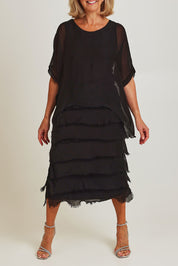Model Sandy wearing the Silk Blend Multi Layers Dress in colour Black (Black), from the front, cropped image