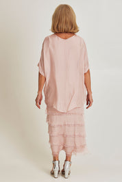 Model Sandy wearing the Silk Blend Multi Layers Dress in colour Blush (Pink), from the back