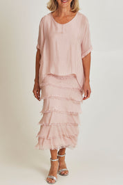 Model Sandy wearing the Silk Blend Multi Layers Dress in colour Blush (Pink), from the front, cropped image