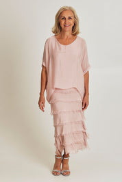 Model Sandy wearing the Silk Blend Multi Layers Dress in colour Blush (Pink), from the front, showing the whole outfit