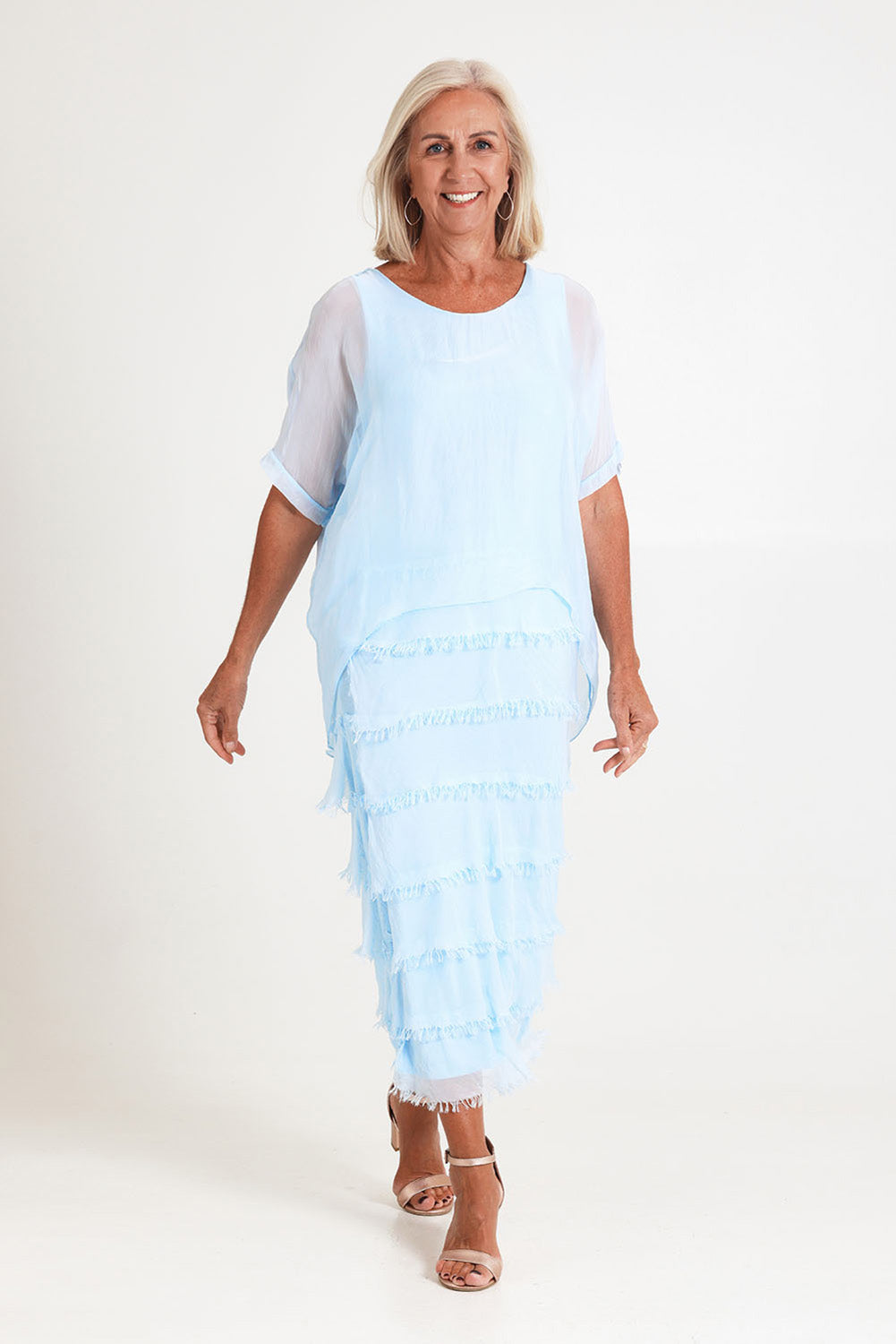 Model Sandy wearing the Silk Blend Multi Layers Dress in colour Celeste (Blue), from the front, showing the whole outfit