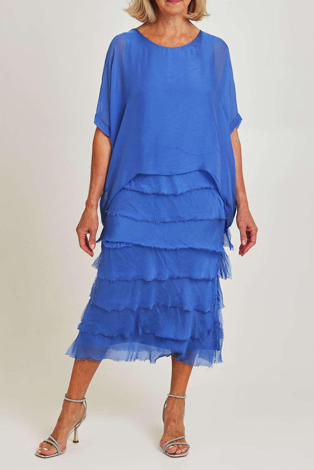 Model Sandy wearing the Silk Blend Multi Layers Dress in colour Cobalt (Blue), from the front, cropped image