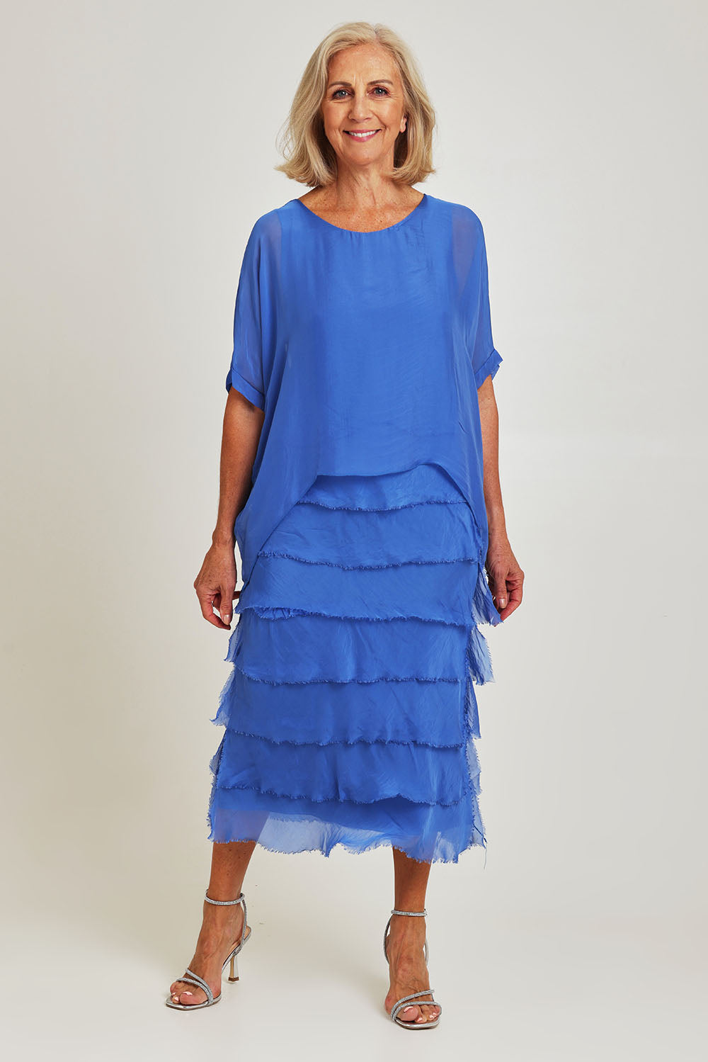 Model Sandy wearing the Silk Blend Multi Layers Dress in colour Cobalt (Blue), from the front, showing the whole outfit