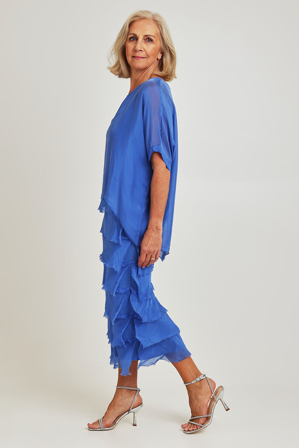 Model Sandy wearing the Silk Blend Multi Layers Dress in colour Cobalt (Blue), from the front, showing the whole outfit