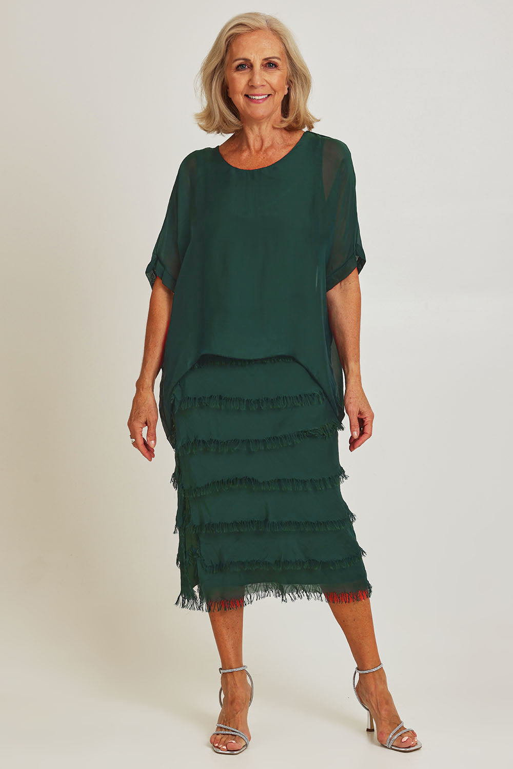 Model Sandy wearing the Silk Blend Multi Layers Dress in colour Darkgreen (Green), from the front, showing the whole outfit