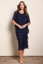 Model Maddiec wearing size 10 of the Silk Blend Multi Layers Dress - Navy in colour Navy, from the front
