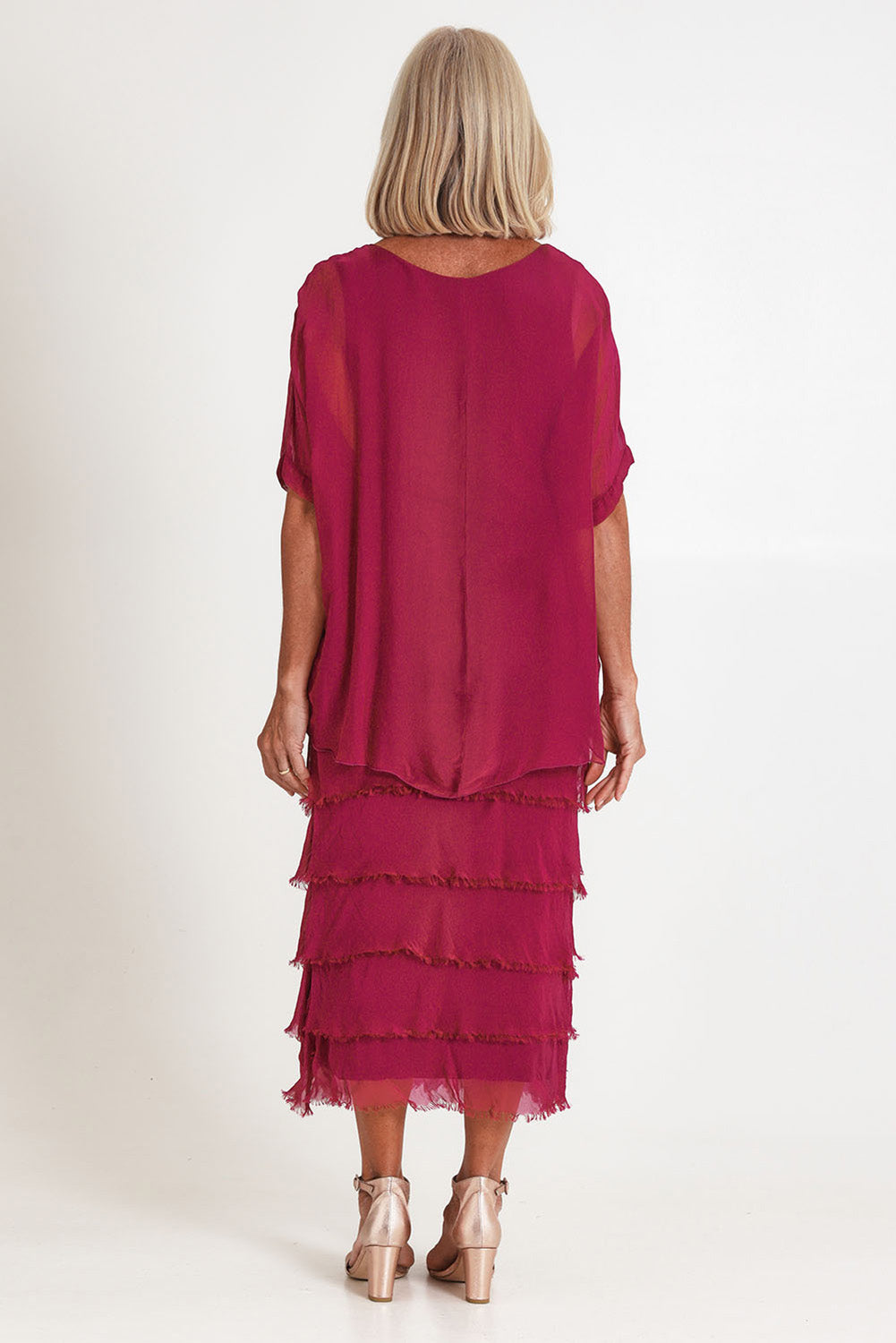 Model Sandy wearing the Silk Blend Multi Layers Dress in colour Orchidea (Purple), from the back