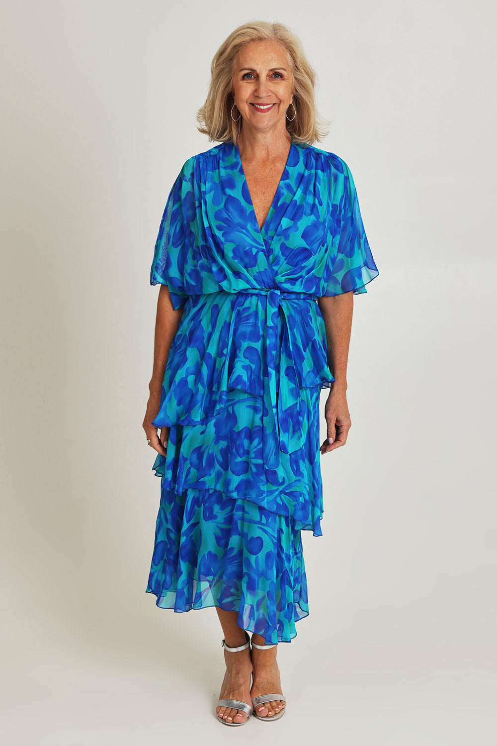 Model Sandy wearing the Short Sleeve Silk Print Dress in colour Cobalt (Blue), from the front, showing the whole outfit
