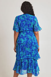Model Terri-Leigh wearing the Short Sleeve Silk Print Dress in colour Cobalt (Blue), from the back
