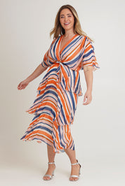 Model Chanel wearing the Short Sleeve Silk Print Dress in colour Orangenavy, from the front, showing the whole outfit