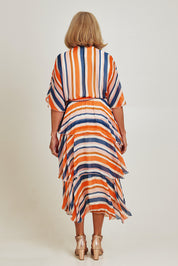 Model Sandy wearing the Short Sleeve Silk Print Dress in colour Orangenavy, from the back
