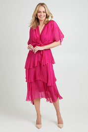 Model Grace wearing the Short Sleeve Silk Dress in colour Raspberry (Pink), from the front, showing the whole outfit