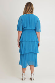 Model Chanel wearing the Short Sleeve Silk Dress in colour Teal (Blue), from the back