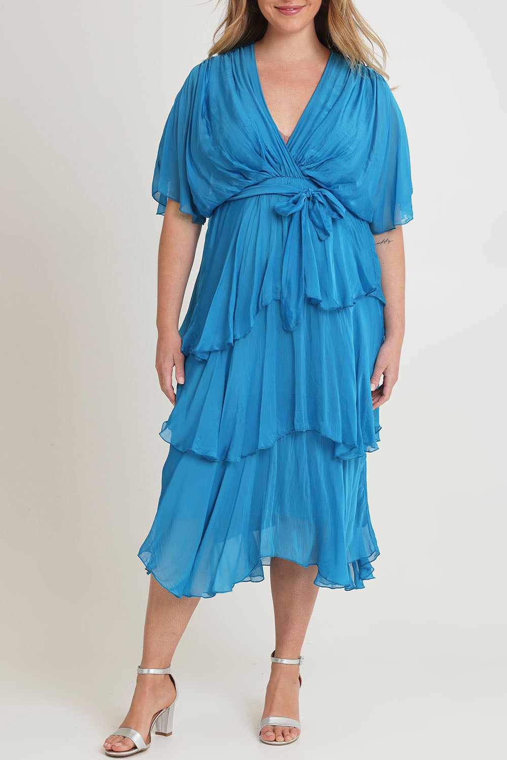 Model Chanel wearing the Short Sleeve Silk Dress in colour Teal (Blue), from the front, cropped image