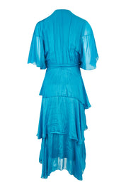 Product shot of the Short Sleeve Silk Dress in colour Teal (Blue), from the back