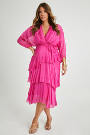 Model Laura wearing the Long Sleeve Silk Dress in colour Raspberry (Pink), from the front, showing the whole outfit
