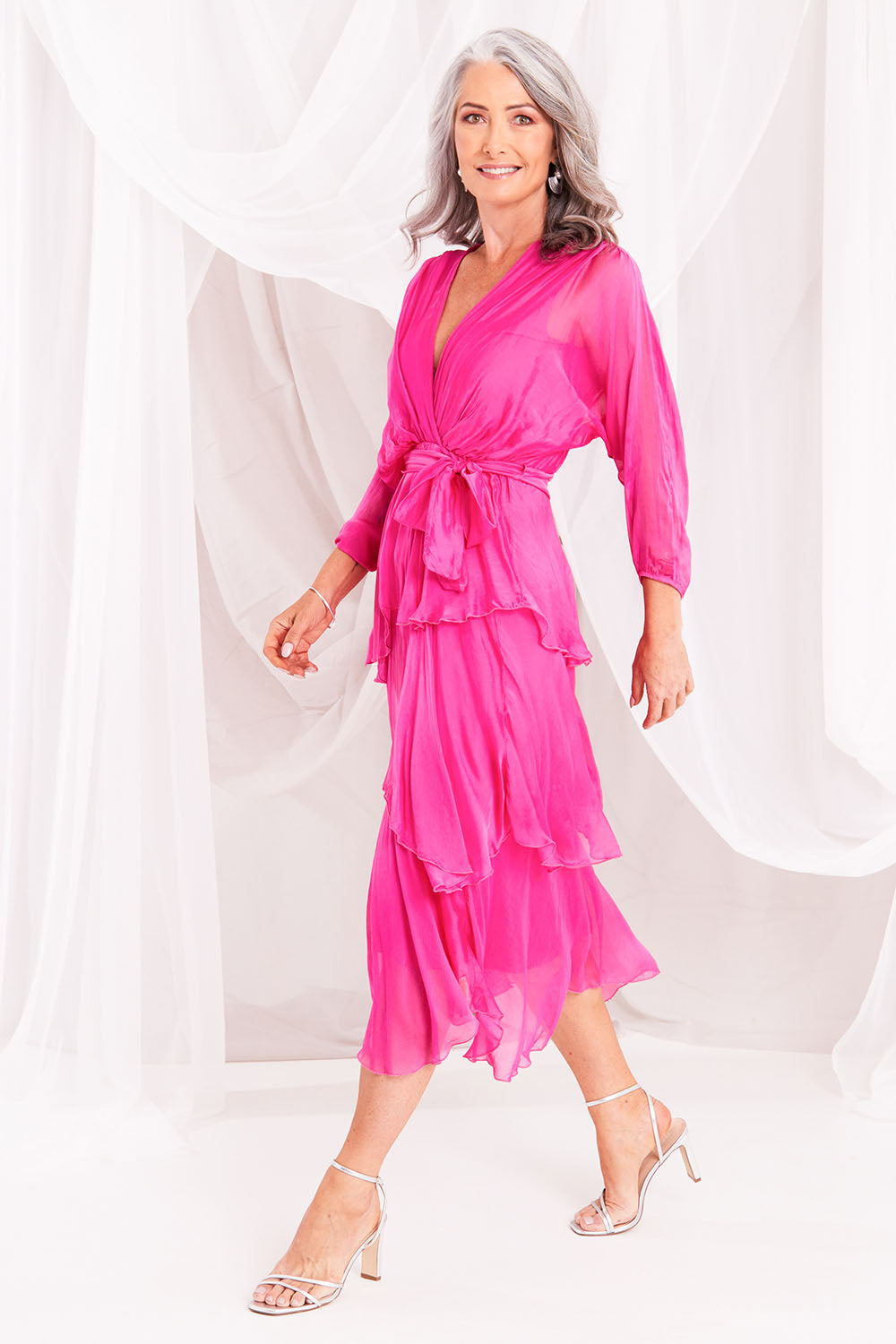 Model Luisa wearing the Long Sleeve Silk Dress in colour Raspberry (Pink), from the front, showing the whole outfit