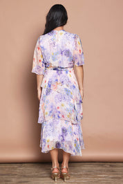 Model Katie wearing the Frill Sleeve Silk Blend Print Dress in colour Jacaranda (White), from the back