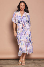 Model Katie wearing the Frill Sleeve Silk Blend Print Dress in colour Jacaranda (White), from the front, showing the whole outfit