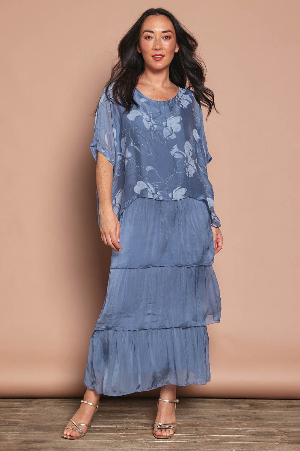 Model Katie wearing the Multi Layer Silk Blend Print Dress in colour Jeansprint (Blue), from the front, showing the whole outfit