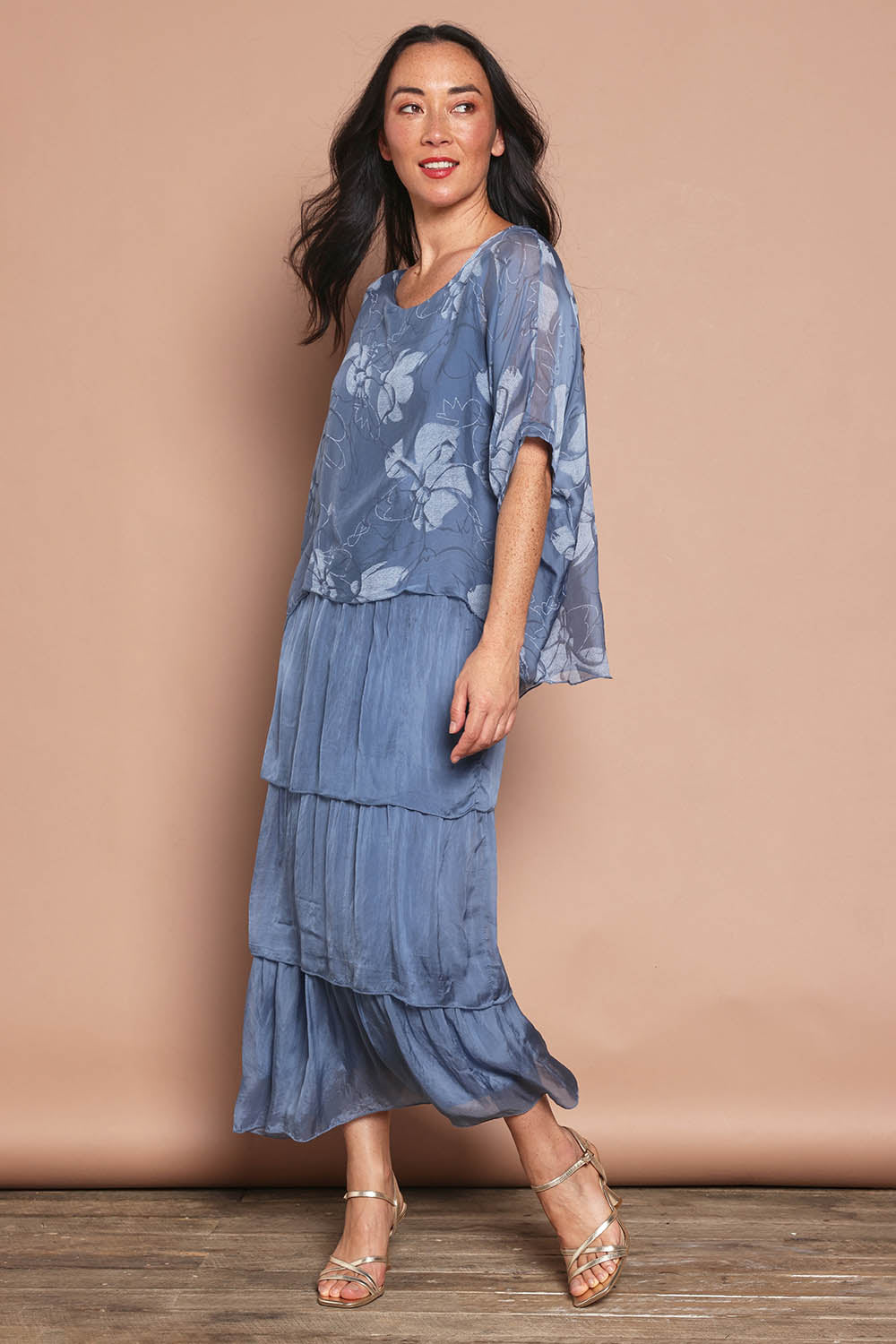 Model Katie wearing the Multi Layer Silk Blend Print Dress in colour Jeansprint (Blue), from the front, showing the whole outfit