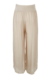 Product shot of the Silk Pant in colour Beige, from the back