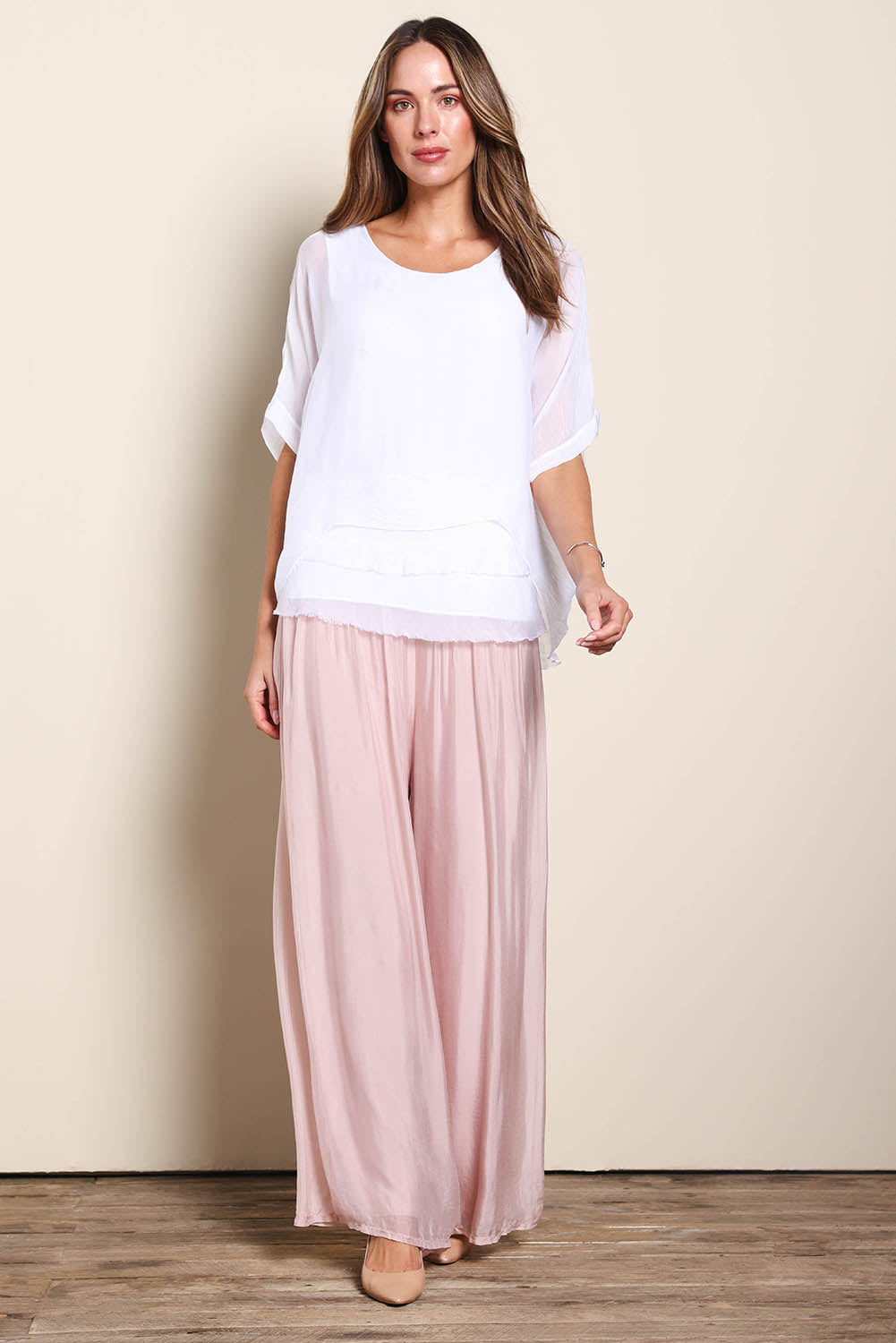 Model Maddiec wearing size 10 of the Silk Pant - BlushPink in colour BlushPink, from the front