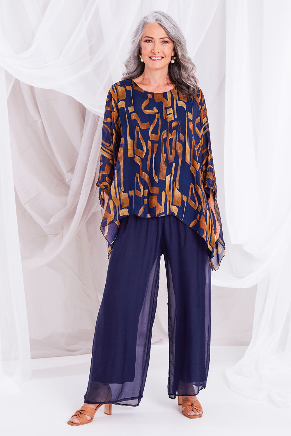 Model Luisa wearing the Silk Pant in colour Navy (Blue), from the front, showing the whole outfit
