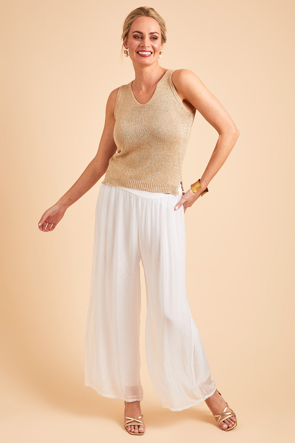 Model Grace wearing the Silk Pant in colour White (White), from the front, showing the whole outfit