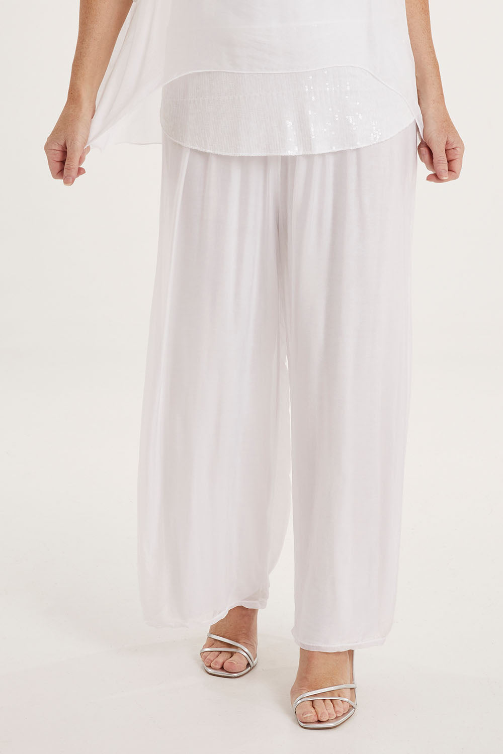 Model Sally wearing the Silk Pant in colour White (White), from the front, cropped image