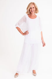 Model Sandy wearing the Silk Sequin Top in colour White (White), from the front, showing the whole outfit