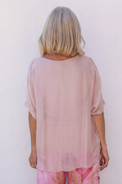 Model Sandy wearing the Silk Blend Three Layer Raw Edge Top in colour Blushpink (Pink), from the back