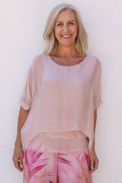 Model Sandy wearing the Silk Blend Three Layer Raw Edge Top in colour Blushpink (Pink), from the front, cropped image