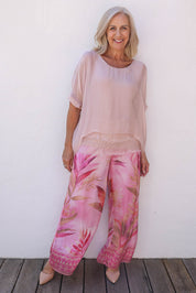 Model Sandy wearing the Silk Blend Three Layer Raw Edge Top in colour Blushpink (Pink), from the front, showing the whole outfit