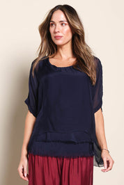 Model Maddiec wearing size 10 of the Silk Blend Three Layer Raw Edge Top - Navy in colour Navy, in a cropped view