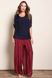 Model Maddiec wearing size 10 of the Silk Blend Three Layer Raw Edge Top - Navy in colour Navy, from the front