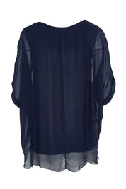 Product shot of the Silk Blend Three Layer Raw Edge Top in colour Navy (Blue), from the back