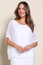Model Maddiec wearing size 10 of the Silk Blend Three Layer Raw Edge Top - White in colour White, in a cropped view