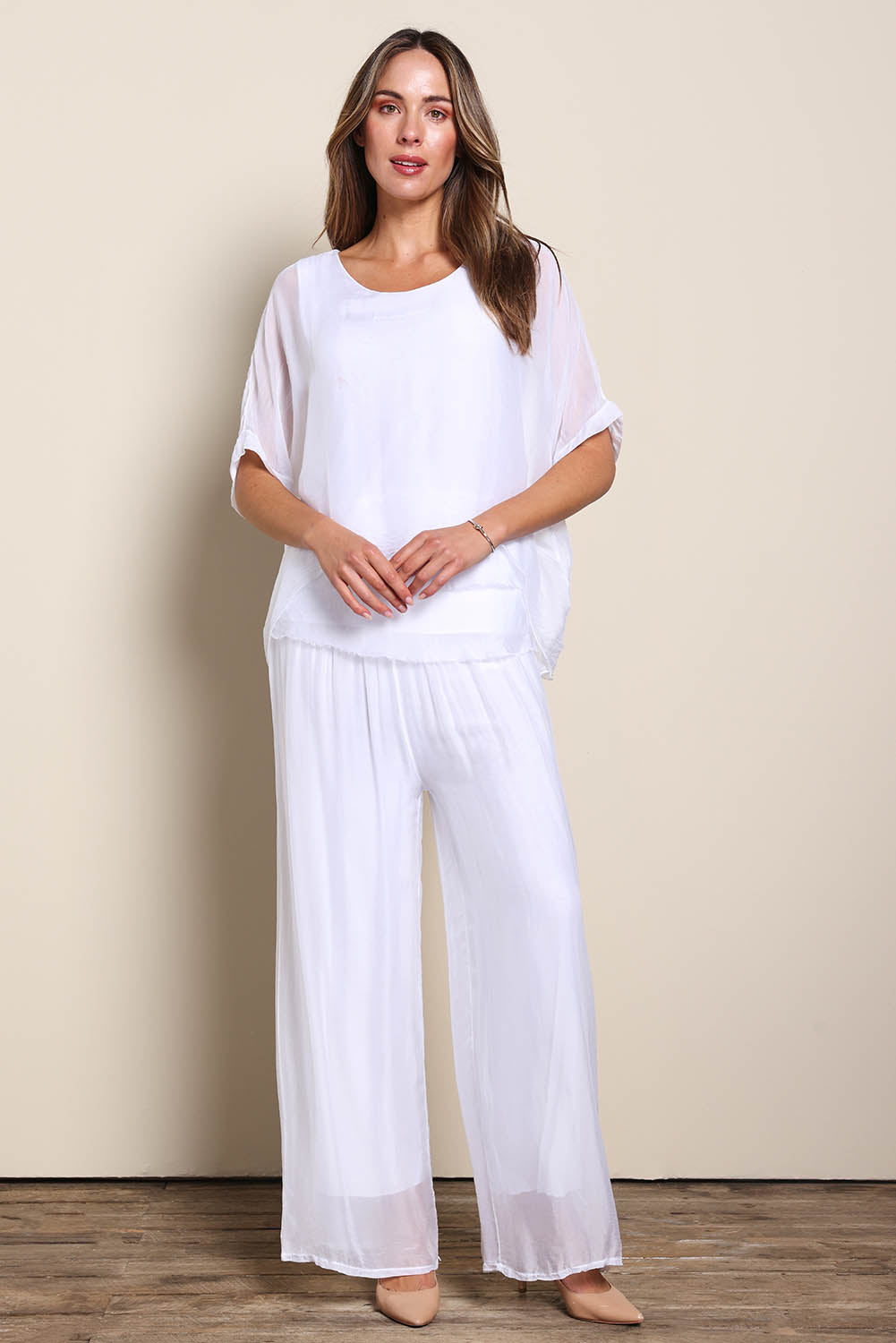 Model Maddiec wearing size 10 of the Silk Blend Three Layer Raw Edge Top - White in colour White, from the front