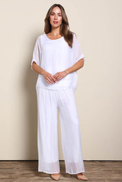 Model Maddiec wearing size 10 of the Silk Blend Three Layer Raw Edge Top - White in colour White, from the front
